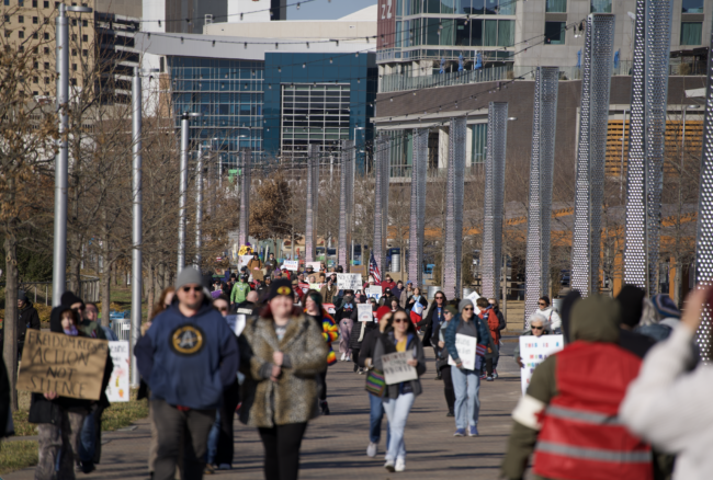 Free America protestors march into Scissortail Park Jan. 20 (Cameron Estes/The Vista)