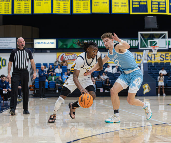 UCO senior forward, Josh Nwankwo, drives the ball for a layup. (Drew Rayburn/The Vista)
