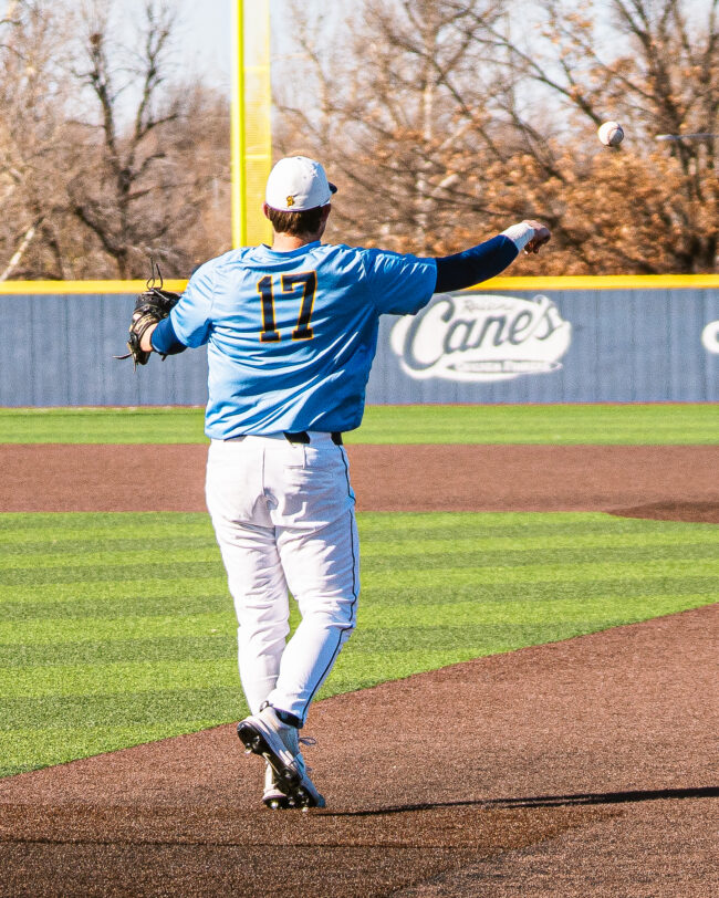 First baseman Drake Lee throws to second base after securing the out. (Hunter George/ The Vista)
