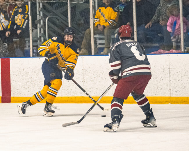 UCO's Davis Thompson goes head-to-head with the OU player. (Hunter George/The Vista) 