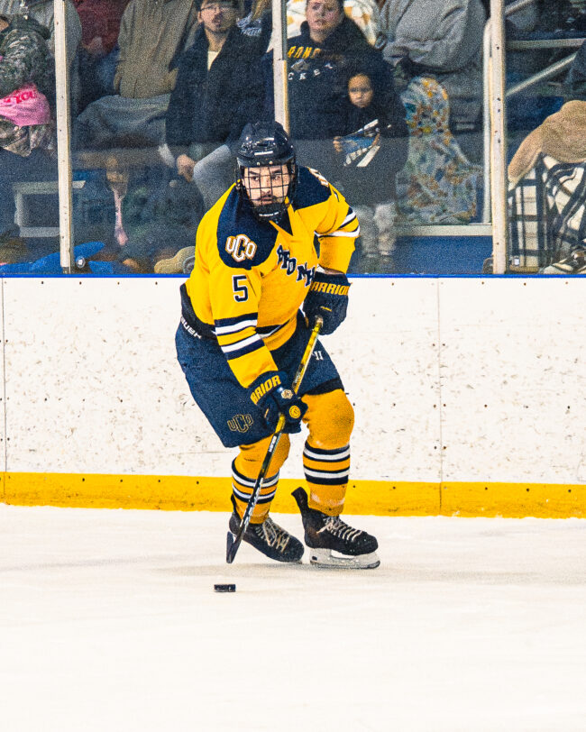 UCO defenseman Mitchell Wilson controlling the hockey puck. (Hunter George/The Vista)