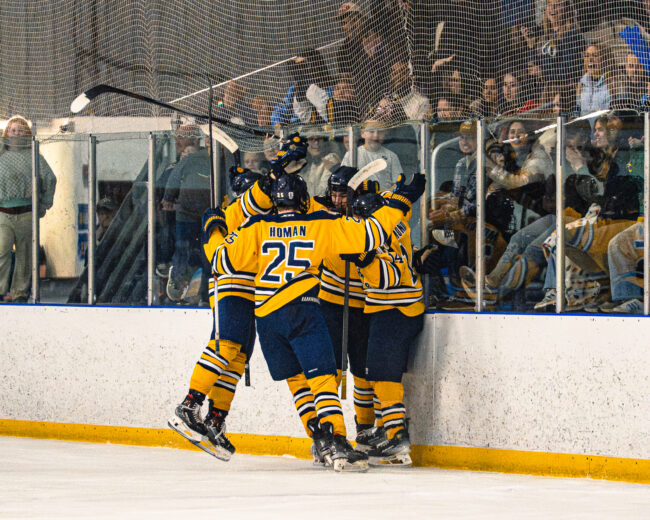 The UCO hockey team celebrates scoring a goal. (Hunter George/The Vista) 