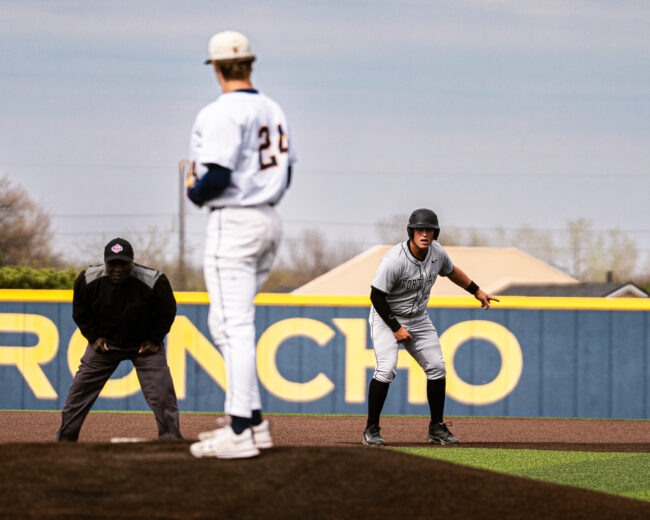 Fort Hayes runner looks at UCO's Danny Satterlee, deciding whether to go back to second base or not. (Hunter George/ The Vista)