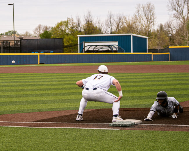 UCO's Drake Lee prepares to catch the ball in hopes of getting the runner on first base out. (Hunter George/ The Vista)