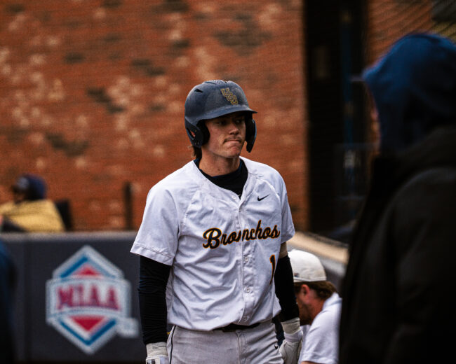 UCO's Cade Mills returns to the dugout after his pop fly ball gets caught. (Hunter George/ The Vista)