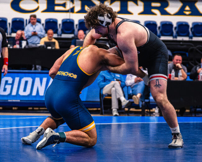 UCO Wrestler on ground at wrestling regionals