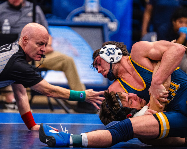 UCO's Bam West puts his opponent in a headlock in hopes of them tapping. (Hunter George/ The Vista) 