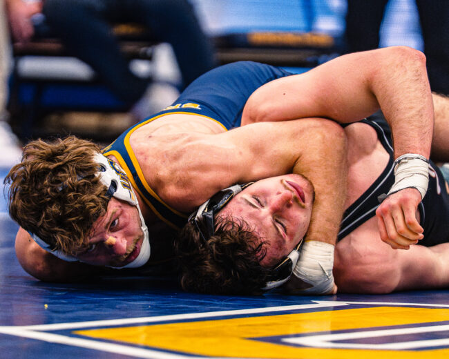 UCO's Branson Britten goes for the pin against his opponent. (Hunter George/ The Vista)