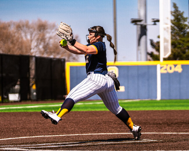 UCO softball player pitches the ball. (Hunter George/The Vista)