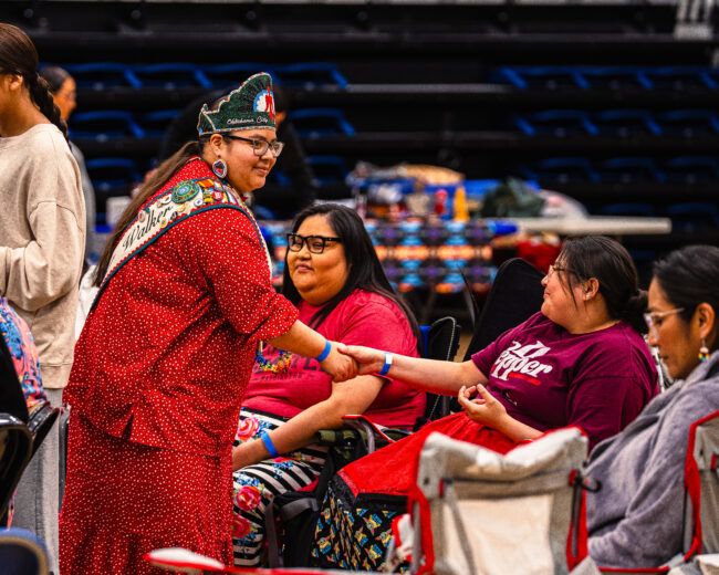 OKC Powwow Club Princess shakes hands with attendees (Hunter George/The Vista)
