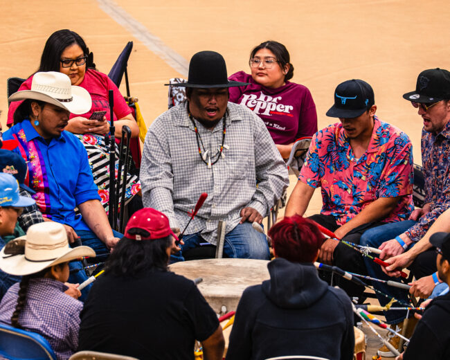 Anthony Yahola, lead singer for the host drum Full Metal Jacket, leads a song during the 52nd Annual UCO Powwow (Hunter George/The Vista)