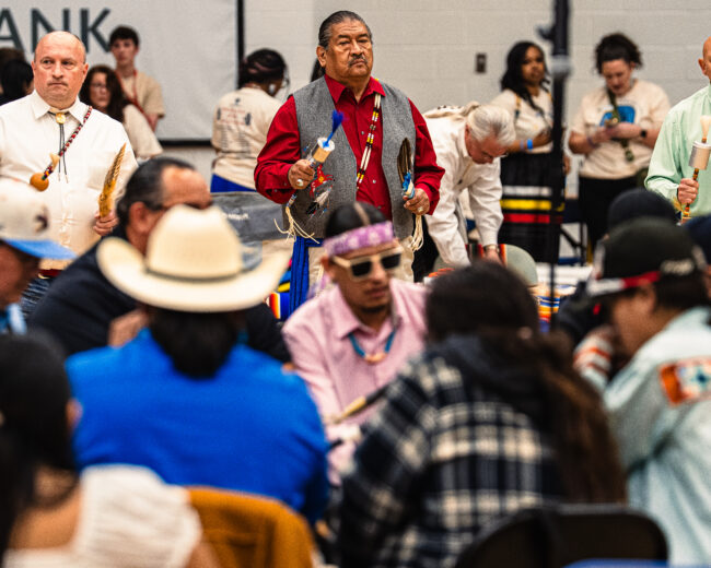A man using the Host drum, Full Metal Jacket, during the Gourd Dance (Hunter George/The Vista)