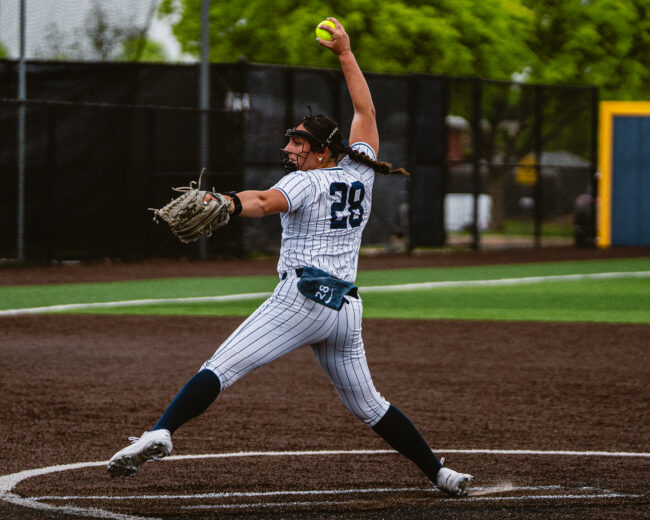 UCO's Carleigh Kinnaird throws a pitch to hopefully end the inning. (Hunter George/ The Vista)