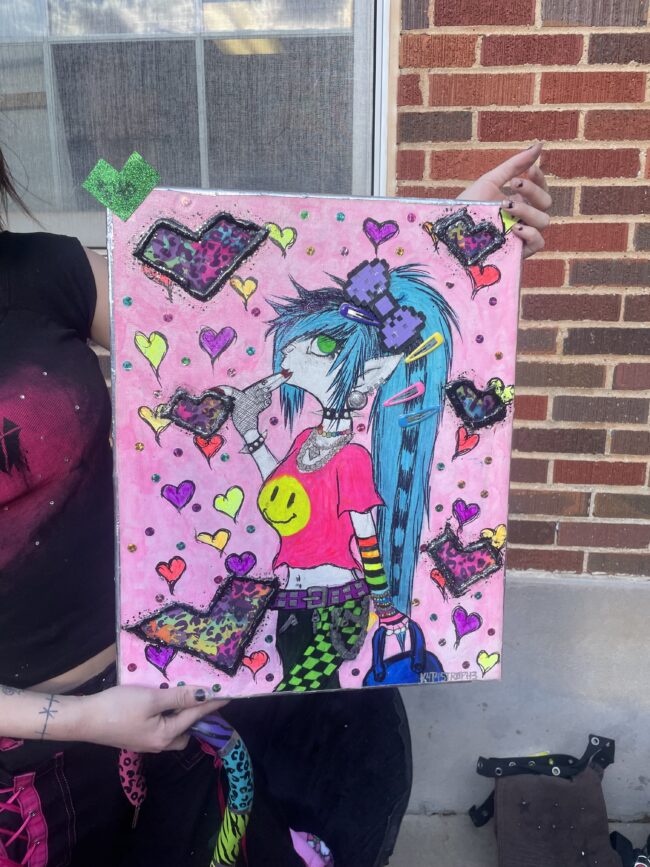 Painting of a girl with blue hair by Khaos Vex (Hannah Aukema/The Vista)