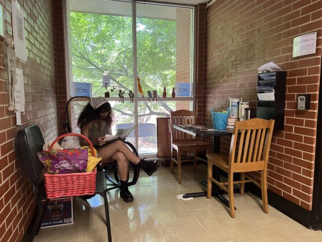 A UCO student occupying the Tiny Nook rocking chair (Chelsea Rios/The Vista)