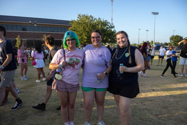 Three students pose for a photo before the party foam begins. (Maycee Elerick/The Vista)