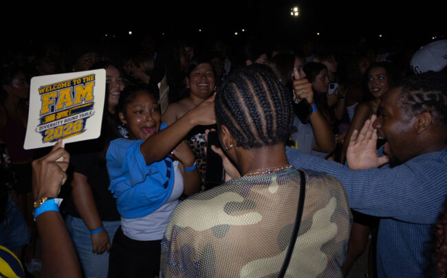 Students dancing together in a crowd. (Maycee Elerick/The Vista)