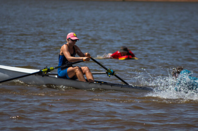 A competitor is pushed into the water to begin the race. (Maycee Elerick/The Vista)