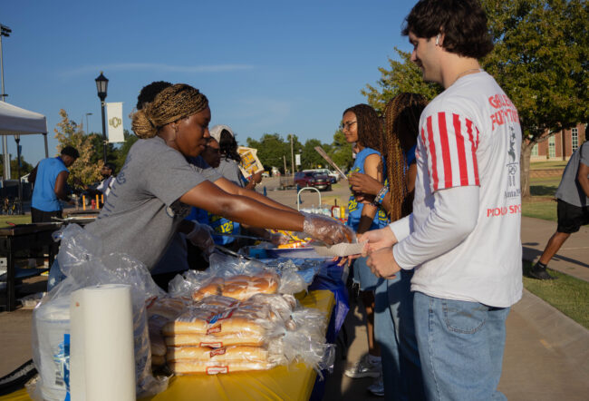 Students lined up to receive food. (Maycee Elerick/The Vista)