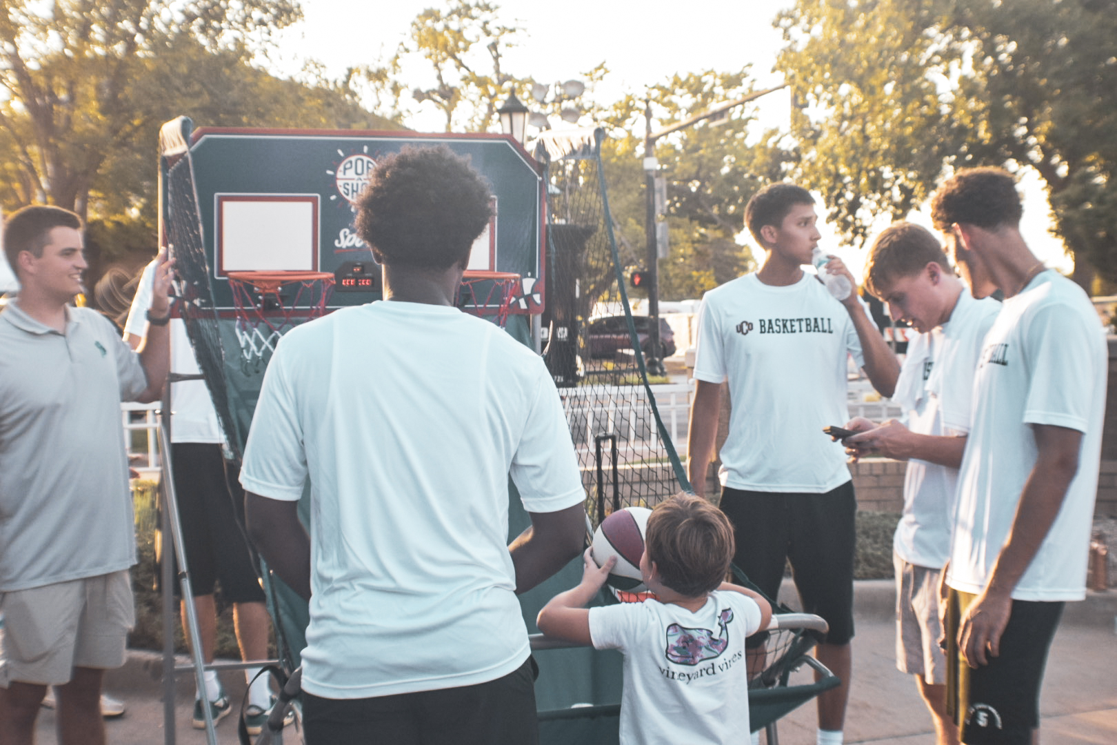 The UCO Basketball team hosting a set-up of a mini hoop. (Mau Chavez/The Vista)