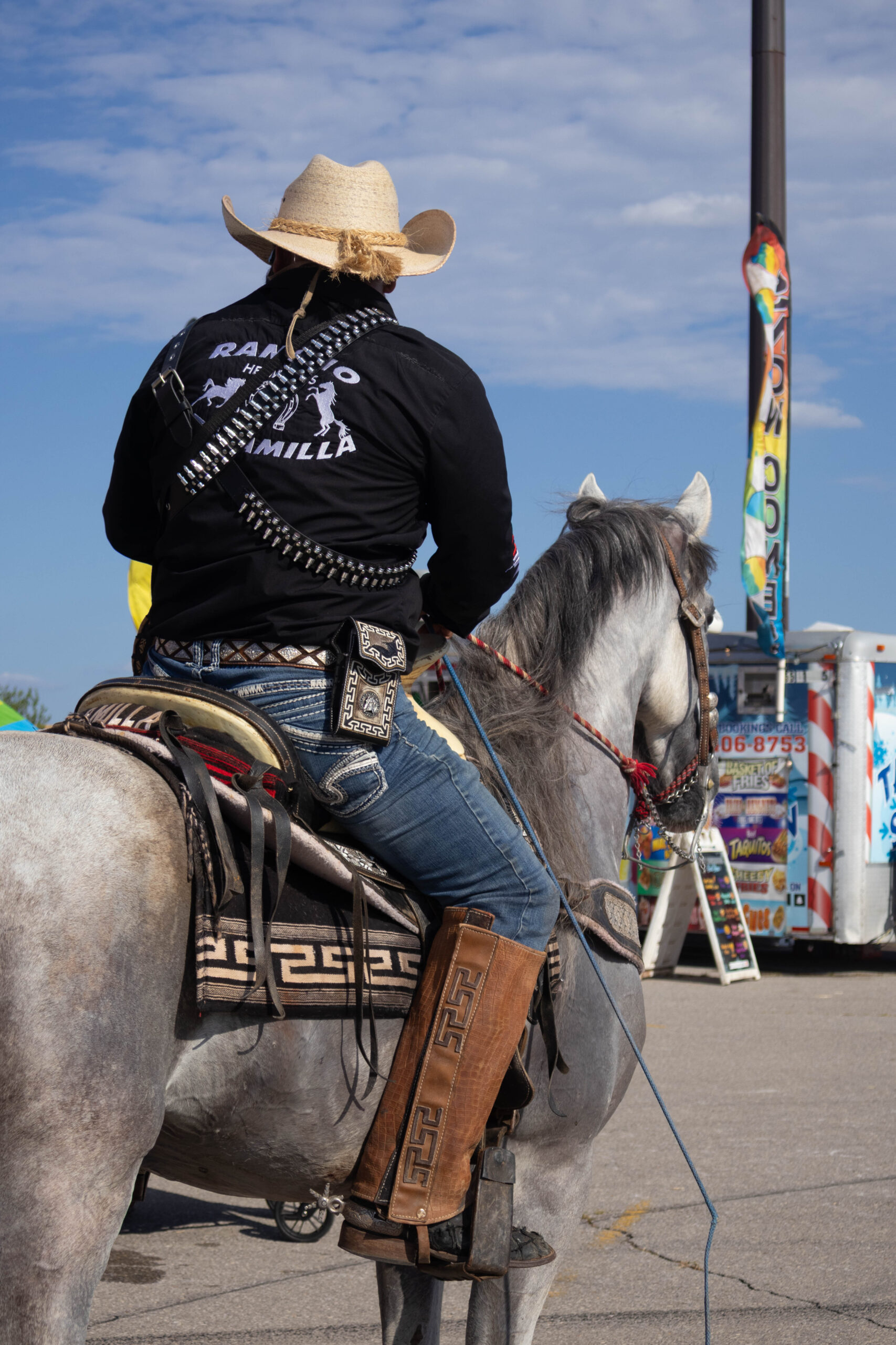 A man and his horse face away. (Maycee Elerick/The Vista)