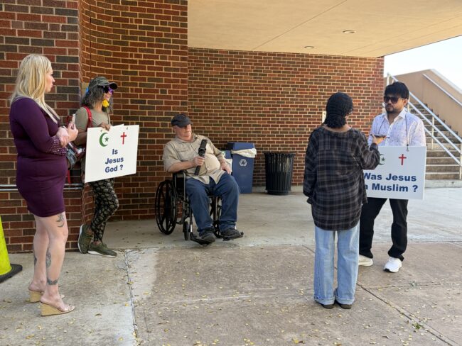 A religious group is pictured outside the Night University Center. (Maycee Elerick/The Vista)