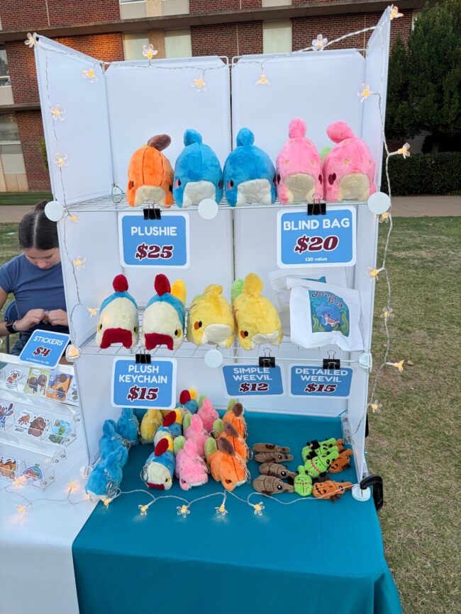 Plushies by Anna Schein being sold at UCO's 26th Annual Asian Moon Festival. Among the plushies are different colored sharks and beetles.