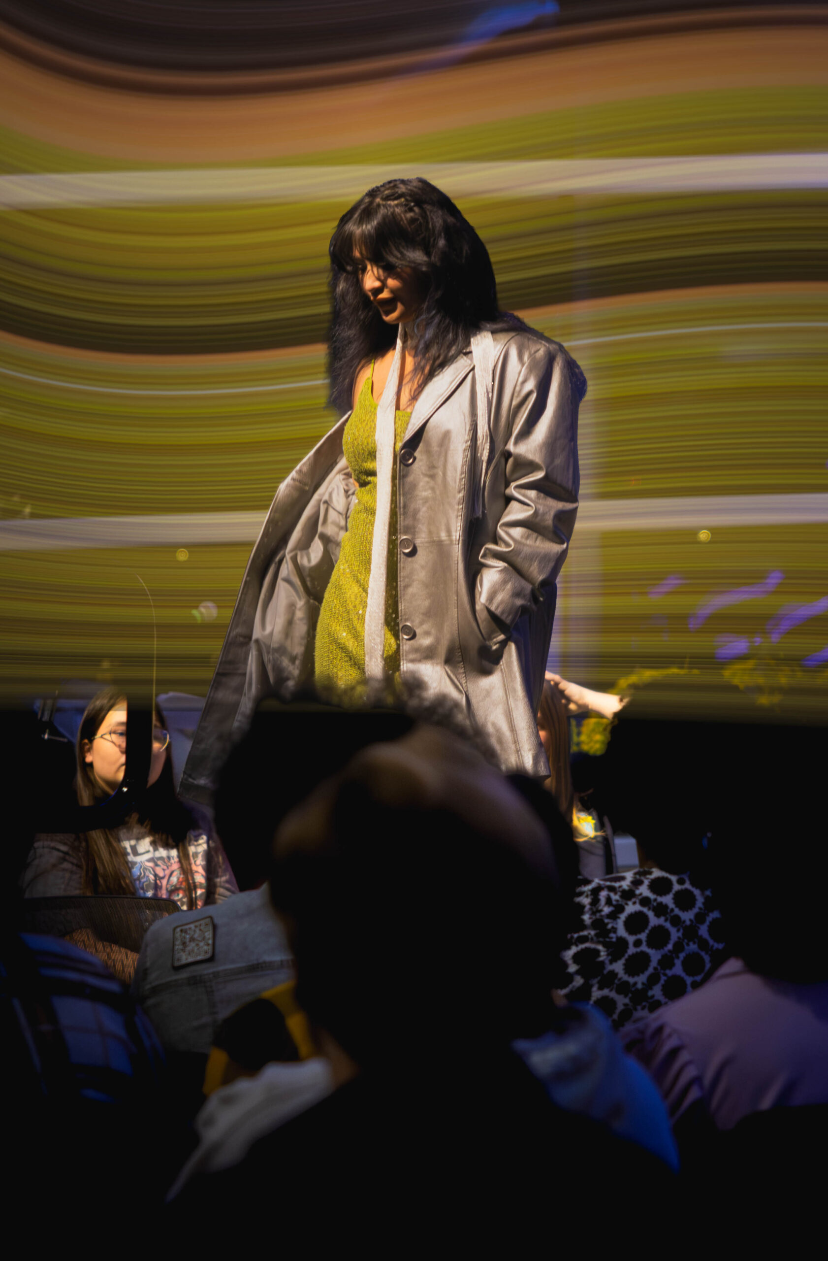 Model looks down and poses (Maycee Elerick/The Vista)