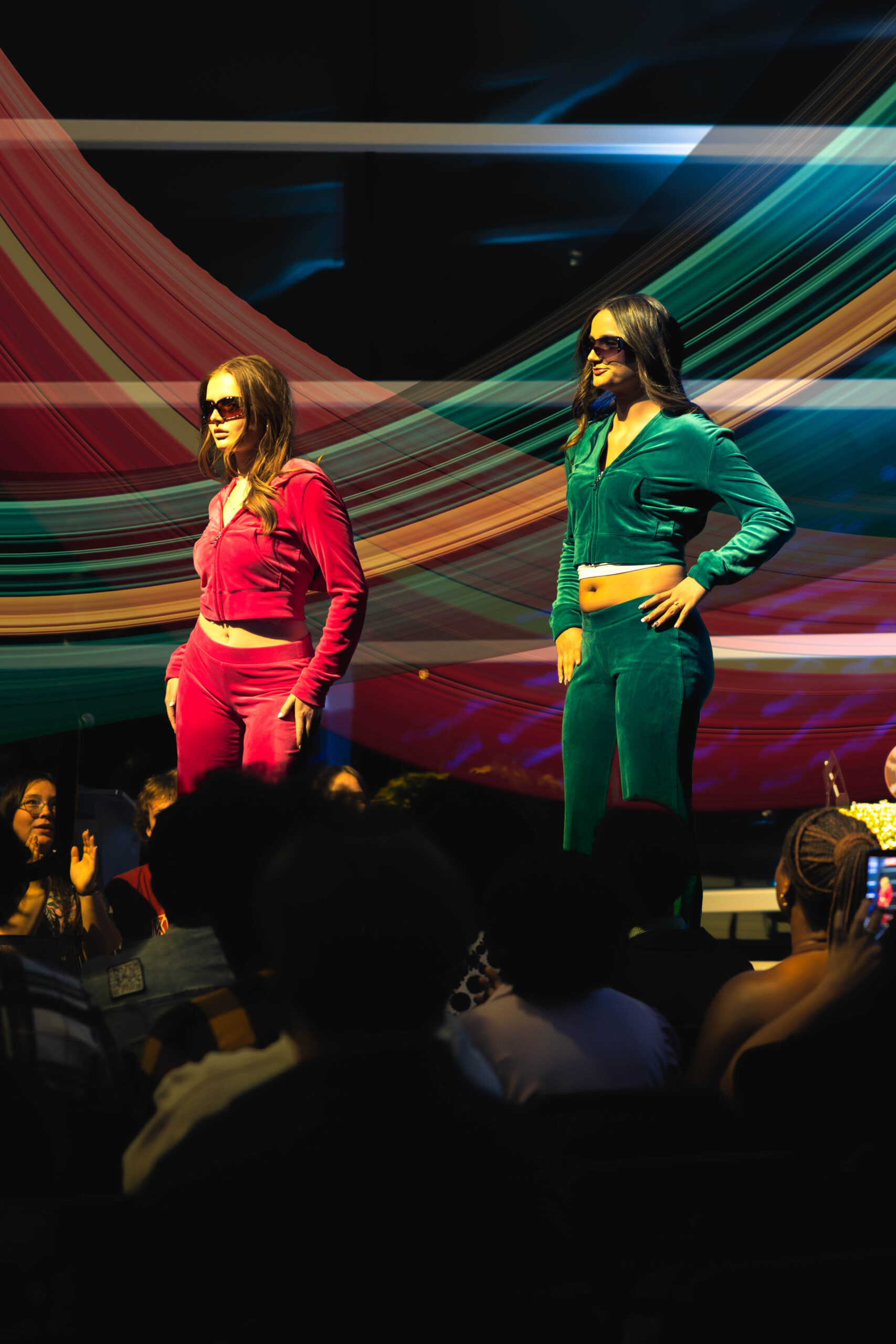 Two models pose in tracksuits(Maycee Elerick/The Vista)