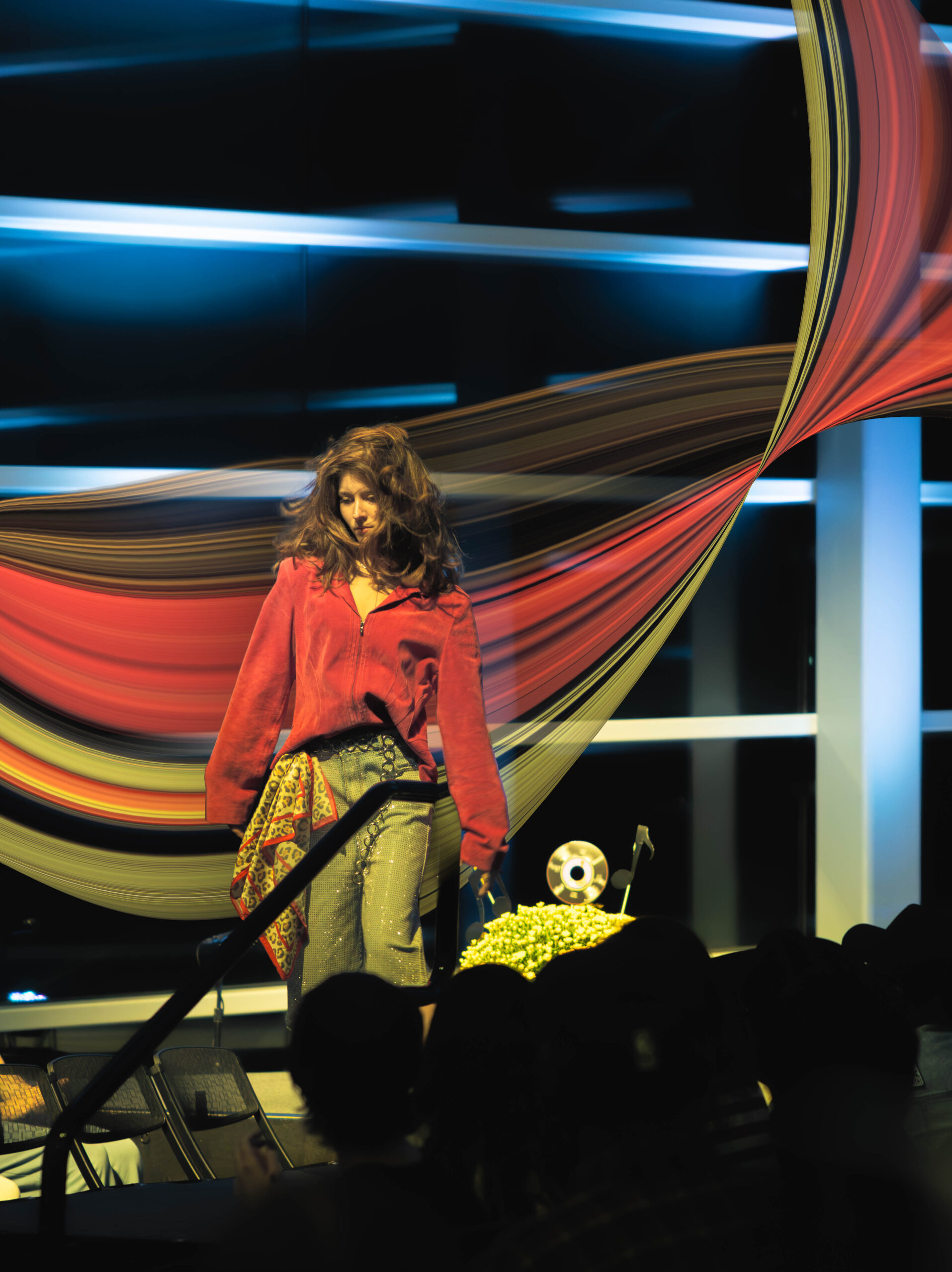 A model caught in motion as she walks down the runway (Maycee Elerick/The Vista)